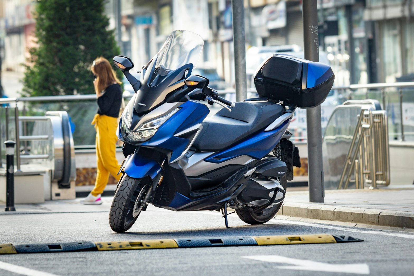 man in black jacket riding black sports bike